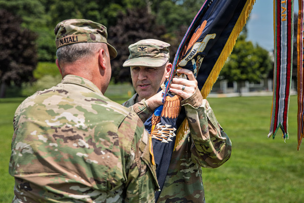 Maj. Gen. Michel Natali, the assistant adjutant general, Army, New York, passes the guidon to Col. Steven P. Perry, incoming commander of the 106th Regiment (Regional Training Institute, New York Army National Guard, during a change of command ceremony conducted at Camp Smith Training Site near Peekskill, N.Y., Aug. 8,2026. The ceremony marked the change of command from Col. William B. Murphy, outgoing commander of the 106th Regiment (Regional Training Institute, to Perry and was presided over by Natali. (U.S. Army National Guard photo by Sgt. Rosa Ibarra)