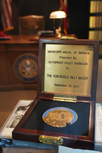 Billy McCoy’s Mississippi Medal of Service rests in an open wooden case. Gov. Haley Barbour presented the medal on September 28, 2011.