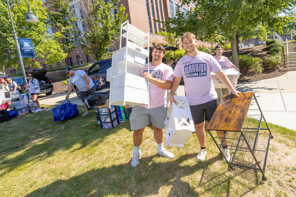 Student volunteers from last year's "Welcome Crew" help students move into residence halls in fall 2025. 