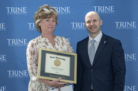 Kim Bennett with framed certificate standing next to Dr. Tony Kline
