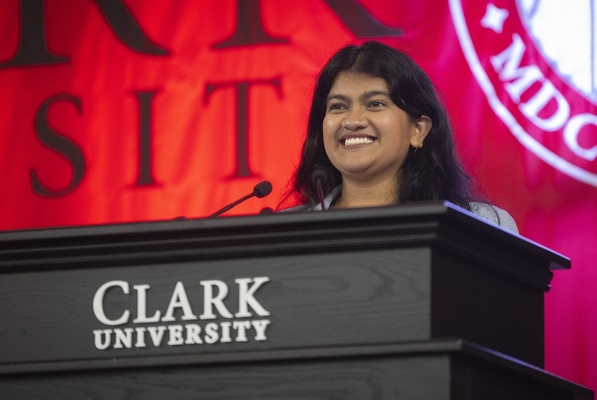 Nishat Zahan speaks at a Clark University lectern