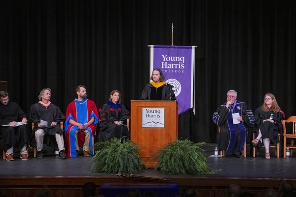 Dr. Chris Sass accepts the 2026 Vulcan Teaching Excellence Award Aug. 14 at Young Harris College's Convocation.