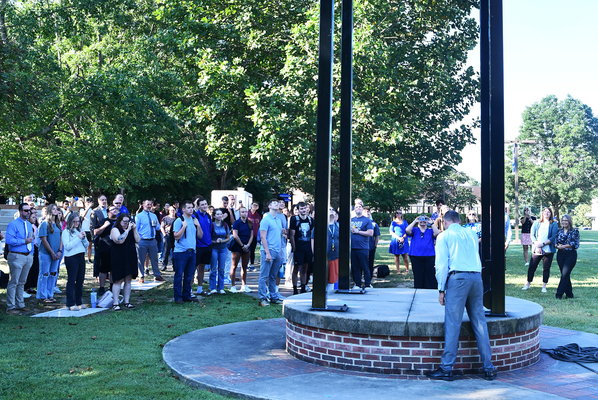 Members of the Lindsey Wilson University community gather around the Victory Bell on the Campus Quadrangle, which was rung by Vice President for Academic Affairs Ray Lutgring, on Monday, Aug. 24, to symbolically begin the 2026-27 school year.
