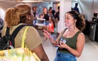 Diana Valdez talks with a student in the Barrington Student Union.