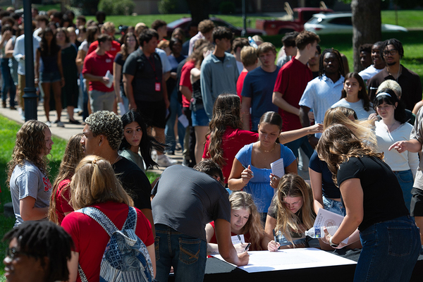THE MONMOUTH COLLEGE PLEDGE: Following the matriculation ceremony, the 270 new students lined up outside of Wallace Hall to put their signatures on the document.