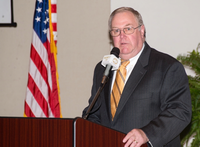 Northeast Mississippi Community College alumni Dr. William "Bill" G. Jackson (center) speaks at the college's Alumni Hall of Fame induction ceremony.