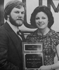 Northeast alumni Dr. William "Bill" G. Jackson (left) is congratulated after being named the college's Alumni of the Year in 1977.