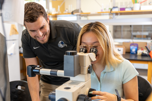 Alex Orfinger, assistant professor of Biology at Dalton State, mentors a student performing undergraduate research in one of Dalton State College's biology labs. 