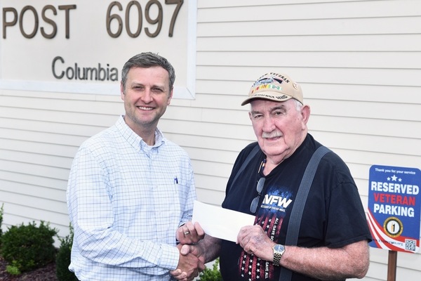 Former Veterans of Foreign Wars Post 6097 Commander Joe Hare, right, presents a check to Lindsey Wilson University Director of Annual Giving Travis Smith ’05 endowing the VFW Post 6097 Endowed Scholarship at Lindsey Wilson.    
