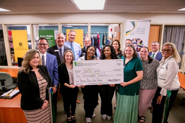 SUNY Delhi staff, students, and SFCU leadership celebrate a $10,000 donation to SUNY Delhi's Bronco Basics food pantry.
