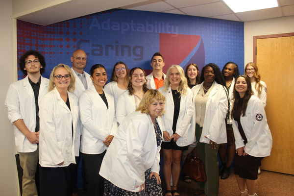 Group of Lakeview College of Nursing students wearing white coats and posing together following the Fall 2026 White Coat Ceremony.