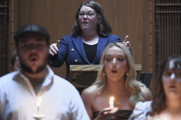 Lindsey Wilson University Director of Choral Activities Jennifer Bersaglia directs the Lindsey Wilson Singers during their annual Standards of Excellence Signing Ceremony, held Tuesday, Sept. 15, in the historic John B. Begley Chapel.