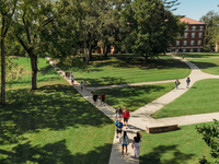 Students walking on campus quad.