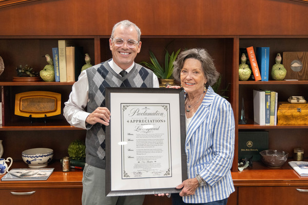 DSU President Dr. Daniel J. Ennis (L) presented Lee Aylward with a formal Proclamation of Appreciation in recognition of her extraordinary contributions to the Delta Center for Culture and Learning.    