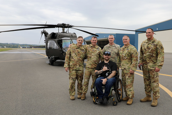 New York Army National Guard Sgt. 1st Class Jacob Pratt poses with the crew who flew his final flight aboard a UH-60 Black Hawk from Army Aviation Support Facility #3 at the Albany International Airport in Latham, NY, on September 17, 2026. In March of 2024 Sgt. 1st Class Pratt was involved in a helicopter crash while patrolling the southwest border outside Rio Grande City, Texas. (New York Army National Guard photo by Stephanie Butler) 