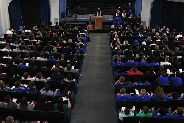 Lindsey Wilson University Chaplain the Rev. Tyler Brumfield, center, gives the benediction at the Church & University Celebration, held Wednesday, Sept. 23, in the university’s V.P. Henry Auditorium.    