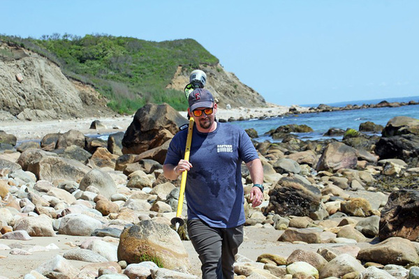 Bryan Oakley walks along the Block Island coast.