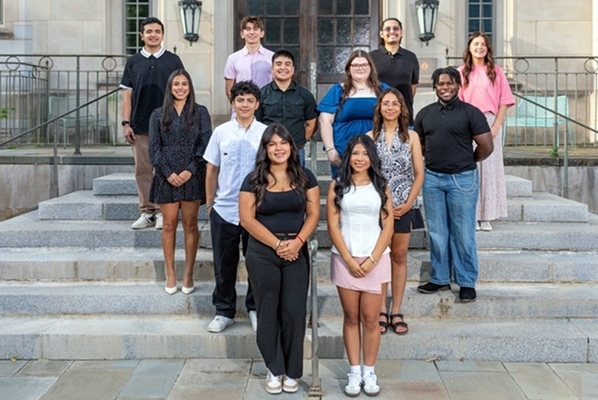 Path scholars stand together in front of the Honors College. 