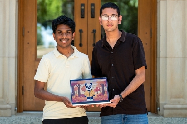 Students stand in front of building holding a computer together with the panda on the screen. 