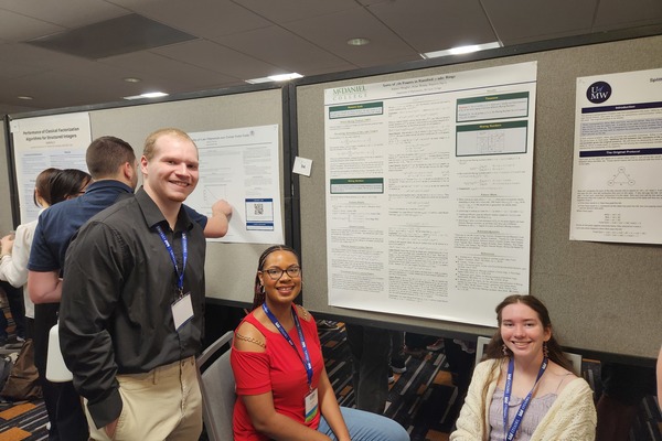 McDaniel students Aidan Wolsey, Keyierra Harris, and Addison Meagher present a poster at MathFest.