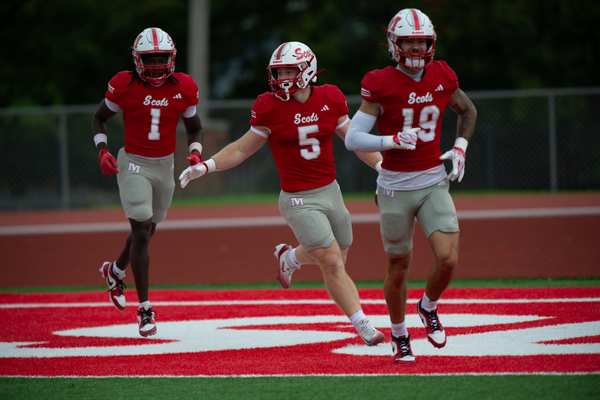 Nate Wrublik (#5) celebrates after one of his touchdown runs on Saturday (Kent Kriegshauser/Monmouth College)