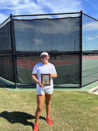 Aviles holding the ITA Junior College Southeast Region Trophy