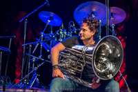 Thomas Leleu poses on stage with his tuba.