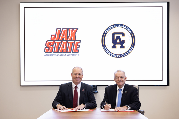 Jax State Presidnet Dr. Don C. Killingsworth, Jr. (Left) and Central Alabama Community College President Jeff Lynn sign an MOU to expand transfer opportunities for CACC students. (Alyssa Cash/Jax State Photo)