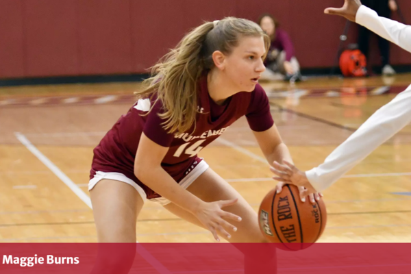 Margaret Burns '29, dribbles a basketball during a game on Muhlenberg College court