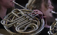 Student plays the French horn
