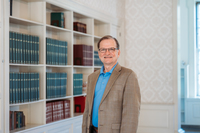 Photo of a man in a library.