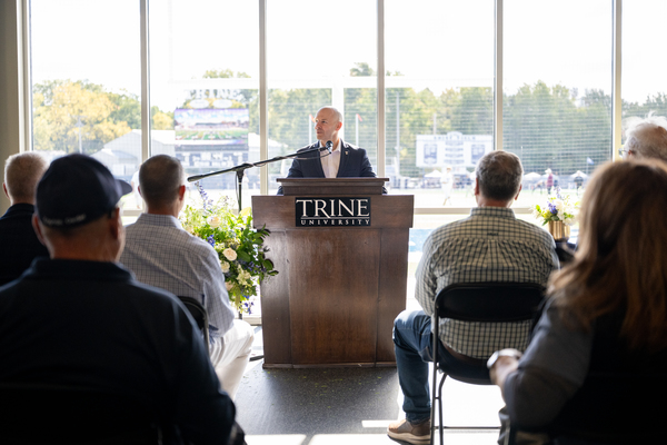 Trine University President Tony Kline, Ph.D., speaks to university alumni and supporters at the dedication of the Trine Family Training Center on Saturday, Oct. 3. (Photo by Laura Pentecost / Trine University)