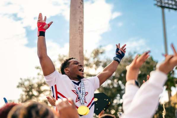 Northwest Cheerleader Davis Hayes III of Cleveland celebrating a win at UCA National Championship at ESPN Wide World of Sports at Walt Disney World in Orlando, FL. Photo by Carly Fox-Mayo.