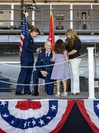 Family pinning on general officer's rank.