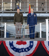 Army and Air Force Officers standing at attention.