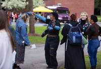 Students dance at a campus block party.