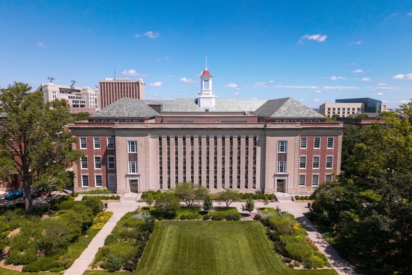 Aerial photo of Love Library South, a multi-story academic library with garden to the south.