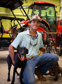 Isaac Haper with his two dogs