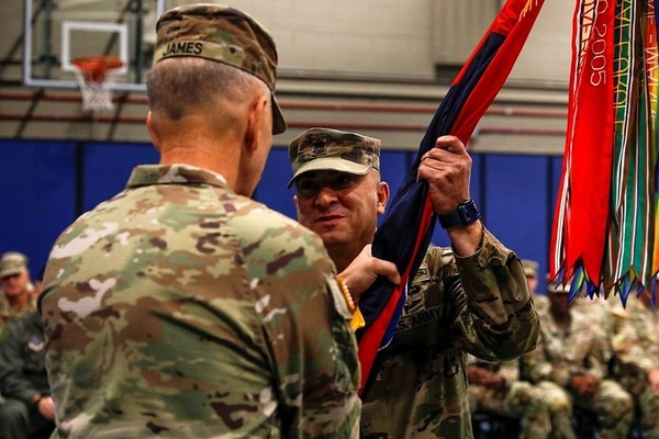  Command Sgt. Maj. Kevin Roeser, an East Amherst resident, accepts the flag of the 42nd Infantry Division from Maj. Gen. Jack James, the outgoing commander of the 42nd Infantry Division, during a ceremony conducted at the New York Army National Guard headquarters in Latham, New York, October 17, 2026. Roeser is now the top enlisted leader for the division, which is one of eight in the Army National Guard. (U.S. Army National Guard photo by Staff Sgt. Grace Nechanicky)