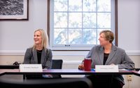 Jennifer Bashant and Suzanne Smith smile during a discussion at SUNY Potsdam.