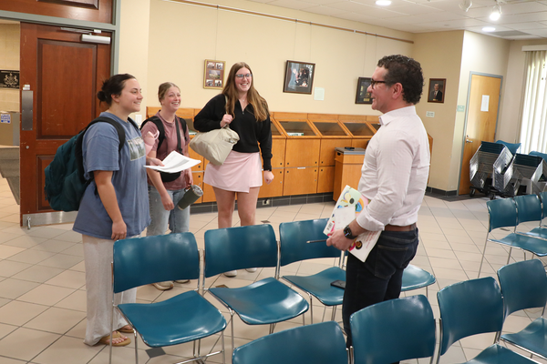 CU President Jeff Osgood talking with students.