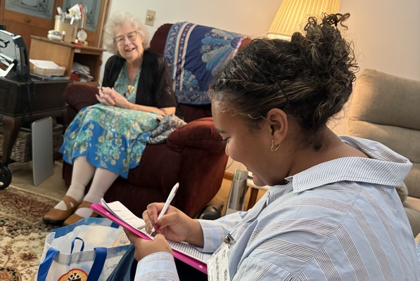 East Stroudsburg University graduate student, Mariah Huertas, works with a Meals on Wheels client. 