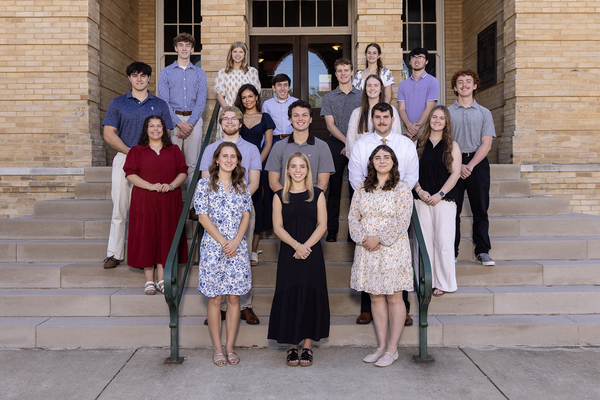FHU student representatives standing on the front steps of Old Main Administration Building 