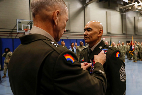 Army Command Sgt. Maj. Arnold Reyes, a Selden resident, is awarded the Legion of Merit Medal by Maj. Gen. Jack James, the 42nd Infantry Division Commander, during his retirement ceremony on Oct. 17, 2026, at New York National Guard headquarters. Reyes concluded 43 years of military service to his nation. (U.S. Army National Guard photo by Staff Sgt. Grace Nechanicky)  