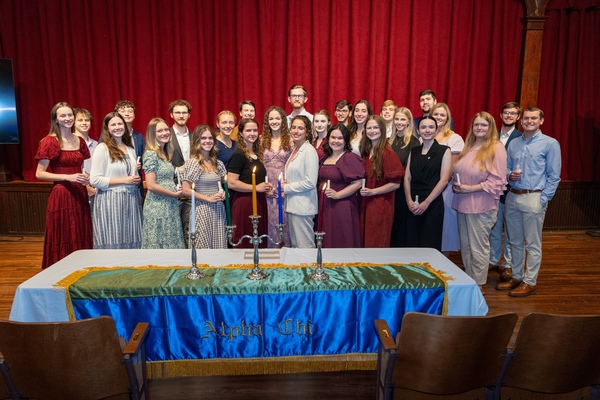 New members of Alpha Chi honor society stand at their induction ceremony in October 2026.