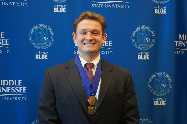 Representation of the achievement named 'Carter Manwaring successfully defends Honors thesis at MTSU'.