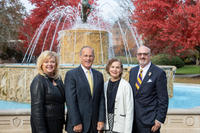 New senior vice presidents, president, and vice president of enrollment pose in front of the Elmira College fountain.