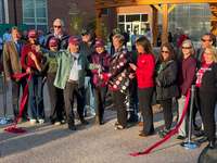 Supporters cut the ribbon in front of the new WISER Botanical Garden at SUNY Potsdam.