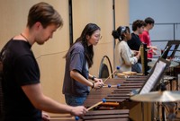 A student plays the marimba in rehearsal.