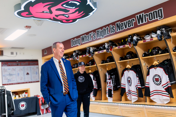 New York State Assemblyman Scott Gray tours the Potsdam Bears women’s hockey locker room with Head Coach Rachel Corbett.